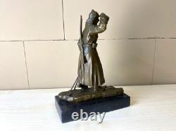 Bronze sculpture of a soldier on skis on a black marble base signed