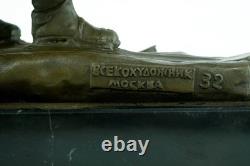 Bronze sculpture of a soldier on skis on a black marble base signed