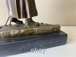 Bronze sculpture of a soldier on skis on a black marble base signed