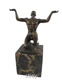 Bronze sculpture of kneeling Adonis on a black marble base after Cesaro
