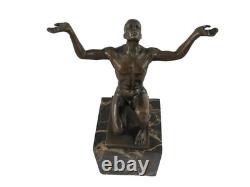 Bronze sculpture of kneeling Adonis on a black marble base after Cesaro