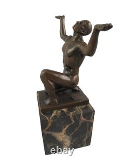 Bronze sculpture of kneeling Adonis on a black marble base after Cesaro