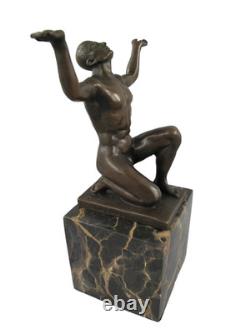 Bronze sculpture of kneeling Adonis on a black marble base after Cesaro
