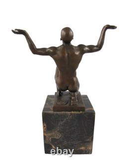 Bronze sculpture of kneeling Adonis on a black marble base after Cesaro