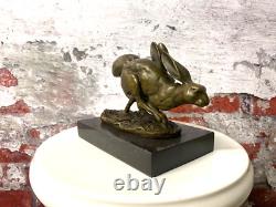 Bronze sculpture of running rabbits on a black marble base after Nick