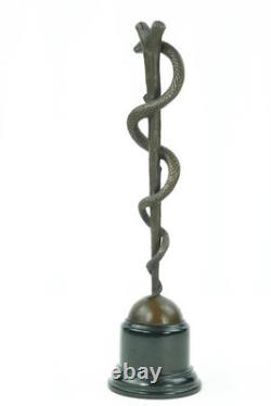 Bronze sculpture of the caduceus of Asclepius on a marble base after Cadueus