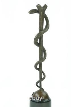 Bronze sculpture of the caduceus of Asclepius on a marble base after Cadueus