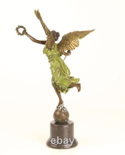 Bronze sculpture of the winged victory on a marble base, signed