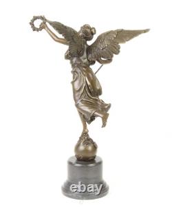 Bronze sculpture of the winged victory on a marble base signed