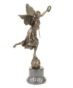 Bronze sculpture of the winged victory on a marble base signed Bronze sculpture of the winged victory on a marble base signed