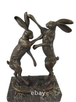 Bronze sculpture of two rabbits in combat on a marble base after Nick