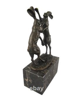 Bronze sculpture of two rabbits in combat on a marble base after Nick