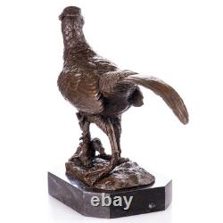 Bronze sculpture on a black marble base, signed