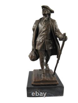 Bronze statue of Benjamin Franklin on a marble pedestal after Milo