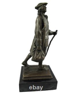 Bronze statue of Benjamin Franklin on a marble pedestal after Milo