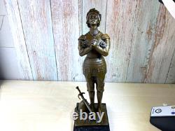 Bronze statue of Joan of Arc on a black marble pedestal after Mercier