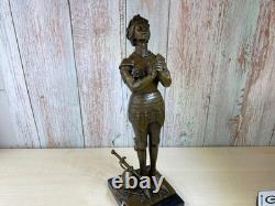 Bronze statue of Joan of Arc on a black marble pedestal after Mercier