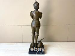 Bronze statue of Joan of Arc on a black marble pedestal after Mercier