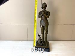 Bronze statue of Joan of Arc on a black marble pedestal after Mercier