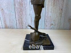 Bronze statue of Joan of Arc on a black marble pedestal after Mercier