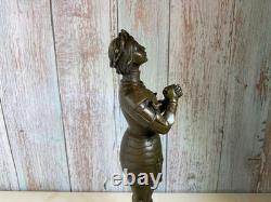 Bronze statue of Joan of Arc on a black marble pedestal after Mercier