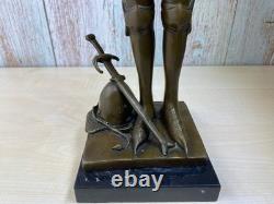 Bronze statue of Joan of Arc on a black marble pedestal after Mercier