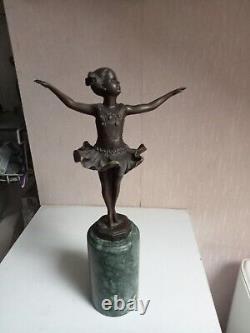 Bronze statuette of a dancer signed, 33 cm in height on a green marble base