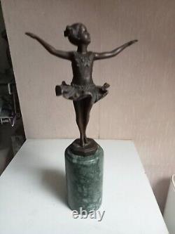 Bronze statuette of a dancer signed, 33 cm in height on a green marble base