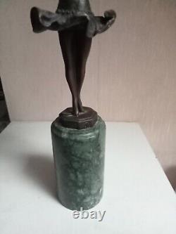 Bronze statuette of a dancer signed, 33 cm in height on a green marble base