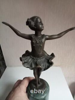 Bronze statuette of a dancer signed, 33 cm in height on a green marble base