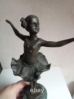 Bronze statuette of a dancer signed, 33 cm in height on a green marble base