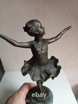 Bronze statuette of a dancer signed, 33 cm in height on a green marble base