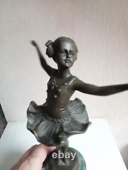 Bronze statuette of a dancer signed, 33 cm in height on a green marble base