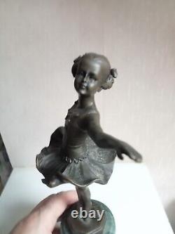 Bronze statuette of a dancer signed, 33 cm in height on a green marble base