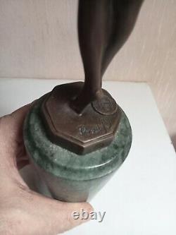 Bronze statuette of a dancer signed, 33 cm in height on a green marble base