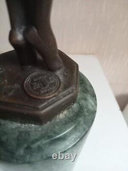 Bronze statuette of a dancer signed, 33 cm in height on a green marble base