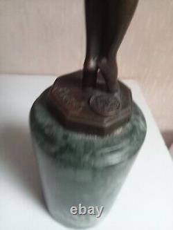 Bronze statuette of a dancer signed, 33 cm in height on a green marble base