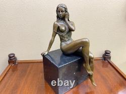 Bronze woman sculpture on a black marble base after J. Patoue
