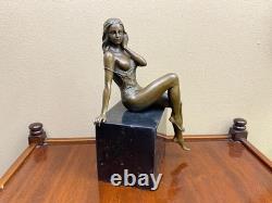 Bronze woman sculpture on a black marble base after J. Patoue