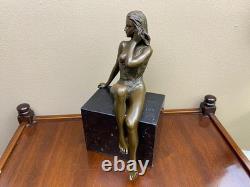 Bronze woman sculpture on a black marble base after J. Patoue