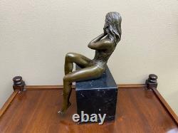 Bronze woman sculpture on a black marble base after J. Patoue