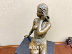 Bronze woman sculpture on a black marble base after J. Patoue