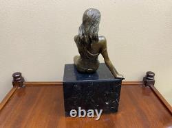 Bronze woman sculpture on a black marble base after J. Patoue