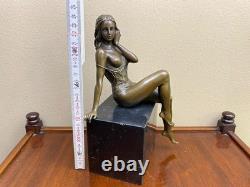 Bronze woman sculpture on a black marble base after J. Patoue