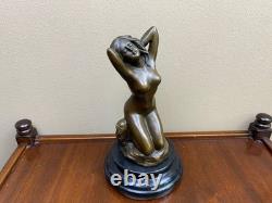 Bronze woman sculpture on a black marble base after Milo