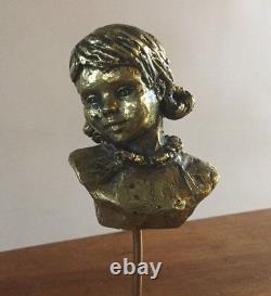 Bust of a little girl. Gilded bronze/marble base. Monogrammed PM. 10x7x5. Height 25.
