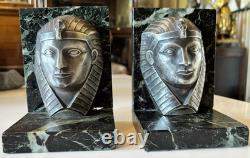 C. CHARLES Pair of Art Deco bookends, bronze pharaohs on marble. Signed