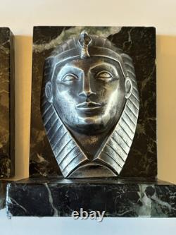 C. CHARLES Pair of Art Deco bookends, bronze pharaohs on marble. Signed