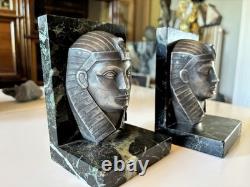 C. CHARLES Pair of Art Deco bookends, bronze pharaohs on marble. Signed