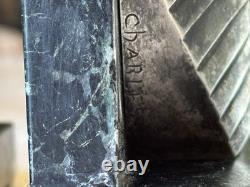 C. CHARLES Pair of Art Deco bookends, bronze pharaohs on marble. Signed